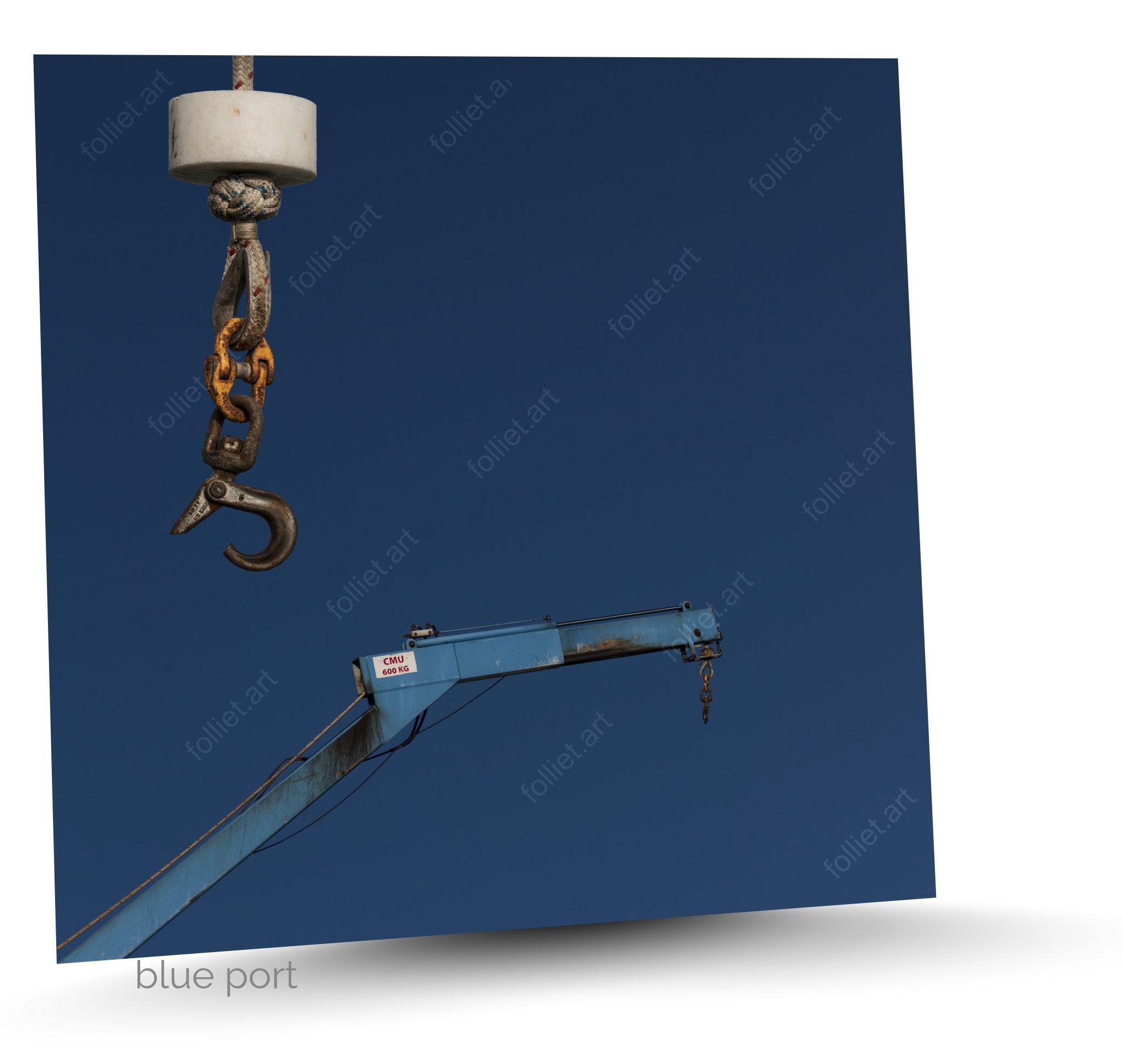 Industrial port crane with rusty hoist hinge under a blue sky - art photography signed FOLLIET