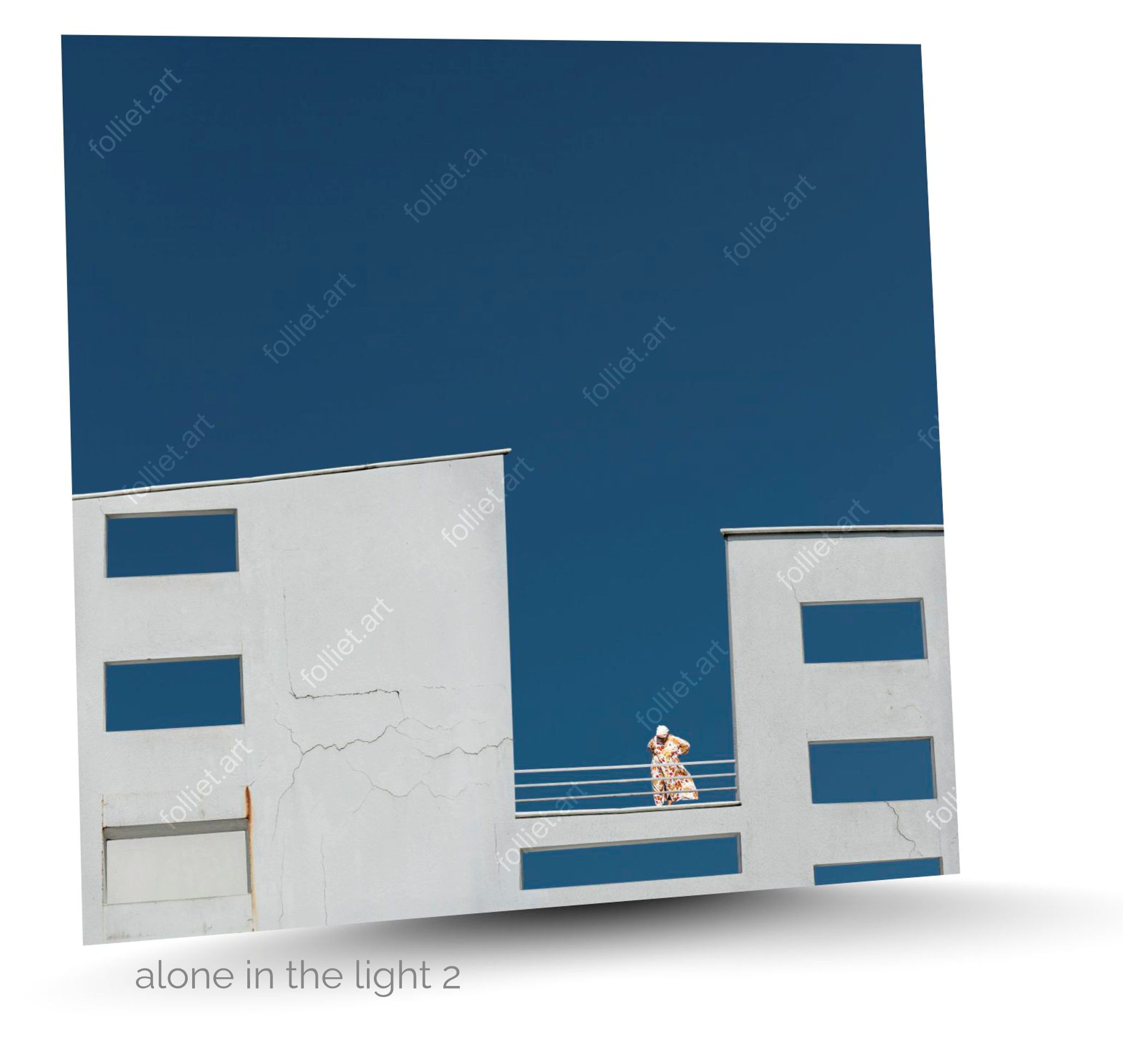 Minimalist architecture with woman in dress under an intense blue sky - fine art photography by Folliet